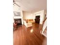 Cozy living room with fireplace, plush seating, and open staircase access at 4438 Lassen Ct, Suwanee, GA 30024