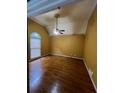 Spacious bedroom featuring hardwood floors, a vaulted ceiling, and a ceiling fan at 71 Southern Golf Ct, Fayetteville, GA 30215