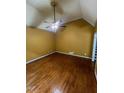 Spacious bedroom featuring hardwood floors, a vaulted ceiling, and a ceiling fan at 71 Southern Golf Ct, Fayetteville, GA 30215