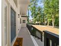 A welcoming front porch featuring a slate gray door, black railings, and a cute 'hello' welcome mat at 974 Clydesdale Dr, Marietta, GA 30062