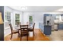 Bright dining area with hardwood floors, stainless steel appliances, and plenty of natural light at 1902 Seals Rd, Dallas, GA 30157