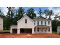 Two-story white brick home with unfinished landscaping, covered porch, and a partially finished garage at 6955 Melody Ridge Rd, Buford, GA 30518