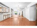 Open-concept living and dining area boasts hardwood floors and an abundance of space and light at 1308 Camelot Dr, Atlanta, GA 30349
