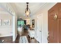 Elegant foyer with hardwood floors, decorative lighting, and views into the living room offering a bright and airy feel at 2676 Varner Ne Dr, Atlanta, GA 30345
