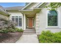 Inviting front entrance with a decorative door, arched window, and manicured landscaping, creating a welcoming ambiance at 2676 Varner Ne Dr, Atlanta, GA 30345