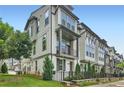Charming townhome with a lovely balcony and manicured front yard in a well-maintained community at 816 S Columbia Dr, Decatur, GA 30030