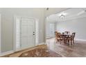 Inviting dining room adjacent to the foyer with tray ceiling and shuttered windows at 4204 Woodfare Nw Ln, Kennesaw, GA 30152