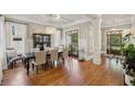 Elegant dining room with hardwood floors, coffered ceilings, and natural light at 1589 Trentwood Ne Pl, Brookhaven, GA 30319