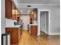 Efficient kitchen with stainless steel appliances, wooden cabinets, and modern countertops at 733 Frederica Ne St # 7, Atlanta, GA 30306