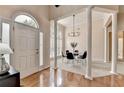 Inviting foyer with hardwood floors, large windows, and a decorative chandelier at 1635 Lake Heights Cir, Dacula, GA 30019