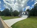 Well-maintained two-story home featuring a two-car garage and a freshly poured concrete driveway at 15 Fontana Ct, Covington, GA 30016