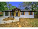Charming renovated home with painted brick, new walkway, updated landscaping, and a welcoming entrance at 1934 Pinedale Pl, Decatur, GA 30032