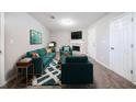 Comfortable living room with ample seating, complemented by a fireplace and bright decor at 2183 Ramblewood Cir, Decatur, GA 30035