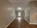 Open living room featuring wood-look flooring, neutral paint, and natural light at 2183 Ramblewood Cir, Decatur, GA 30035