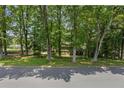 View of the house from across the street, framed by mature trees at 3120 Beechwood Se Dr, Marietta, GA 30067