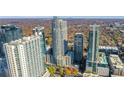 Panoramic aerial view showcasing high-rise buildings and a vibrant cityscape with lush greenery at 855 Peachtree Ne St # 2812, Atlanta, GA 30308