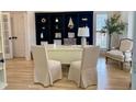 Stylish home office with built-in shelving, a large desk, natural light, and comfortable seating at 1813 Baldwin Farms Dr, Marietta, GA 30068