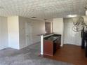 Open-concept living space with bar seating and access to the second floor at 730 Georgetown Ln, Jonesboro, GA 30236