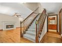 Inviting living room with a fireplace, hardwood floors and a staircase at 4211 Burnt Hickory Nw Rd, Marietta, GA 30064