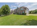 Charming two-story home with a large lawn and side-entry garage at 4315 Balsam Bark Dr, Cumming, GA 30028