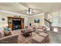 Comfortable living room with ceiling fan, plush seating, and decorative rug, perfect for relaxing and entertaining at 4315 Balsam Bark Dr, Cumming, GA 30028