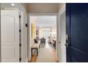 Entryway with a bench and a view into the living room showcases the home's open layout at 1055 Piedmont Ne Ave # 401, Atlanta, GA 30309