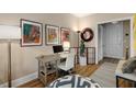Bright home office area features a desk, artwork, and comfortable seating at 1055 Piedmont Ne Ave # 401, Atlanta, GA 30309