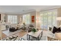 Cozy living room with natural light, plantation shutters and views of trees outside the window at 1055 Piedmont Ne Ave # 401, Atlanta, GA 30309