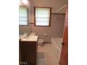 Cozy bathroom with tiled walls, offering functionality in a compact space, perfect for everyday use at 1410 Willis Mill Sw Rd, Atlanta, GA 30311