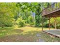 Expansive backyard featuring a deck with lush greenery providing privacy and a serene outdoor space at 3357 Huntwood Ct, Decatur, GA 30034