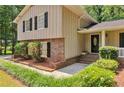 A closer shot of this home reveals attractive brick accents and well-maintained landscaping at 3357 Huntwood Ct, Decatur, GA 30034