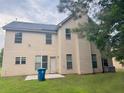 Spacious backyard featuring a patio area and ample space for outdoor activities at 3429 Lake End Dr, Loganville, GA 30052