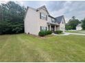 Well-maintained home with a spacious yard and mature trees, offering privacy at 3429 Lake End Dr, Loganville, GA 30052