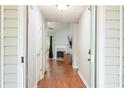 Inviting foyer with wood floors leads into the living room with a fireplace, creating a warm atmosphere at 5279 Leecroft Dr, Buford, GA 30518