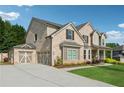 Elegant brick home with a three-car garage and a beautifully landscaped front yard at 4090 Sierra Knolls Ct, Cumming, GA 30040