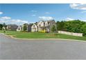 Beautiful home with green lawn and a well-manicured yard in a quiet neighborhood at 4090 Sierra Knolls Ct, Cumming, GA 30040