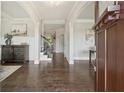Elegant foyer featuring hardwood floors, a staircase, and decorative molding at 4090 Sierra Knolls Ct, Cumming, GA 30040