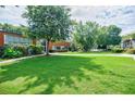 A beautiful condo building with well-manicured landscaping and lush green lawn at 5200 Peachtree Rd # 1104, Atlanta, GA 30341