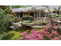 Inviting brick home with manicured lawn and vibrant azaleas enhancing curb appeal at 3755 Kayanne Ct, Tucker, GA 30084