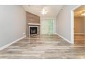 Bright living room featuring a fireplace, sliding glass door, and light-colored flooring at 5354 Cherry Wood Drive Dr, Stone Mountain, GA 30083