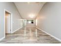 Spacious living room with modern flooring, connecting seamlessly to the kitchen and dining area at 5354 Cherry Wood Drive Dr, Stone Mountain, GA 30083