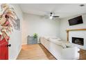 Bright living room features a white fireplace and light-colored flooring at 3076 Montheath Pass, Duluth, GA 30096