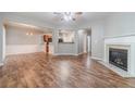 Spacious living room with hardwood floors and a fireplace at 1346 Upshur Pl, Buford, GA 30519