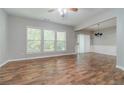 Bright living room featuring hardwood floors and ample natural light at 1346 Upshur Pl, Buford, GA 30519