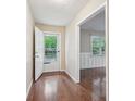 Bright entryway with hardwood floors, white trim, and a view into the adjacent living space at 1952 Winding Creek Sw Ln, Marietta, GA 30064