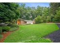 Charming ranch-style home with well-manicured lawn and mature trees at 2072 Castleway Ne Dr, Atlanta, GA 30345