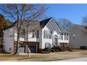 Beautiful two-story home featuring a brick-accented front, a well-maintained yard, and an attached two-car garage at 1305 Bramlett Forest Trail Southeast Trl, Lawrenceville, GA 30045