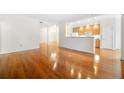 Open concept living space with gleaming hardwood floors and easy access to the kitchen at 50 Biscayne Nw Dr # 2113, Atlanta, GA 30309