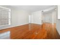 Hardwood floored living room with white walls offers plenty of natural light and easy access to entry at 50 Biscayne Nw Dr # 2113, Atlanta, GA 30309