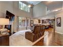 Bright and airy living room with hardwood floors, fireplace, and tall ceilings at 1239 Side Step Trace, Lawrenceville, GA 30045